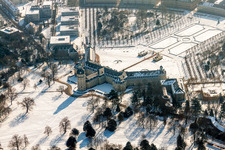 Wintry snowy Building complex in the park of the castle Schloss Karlsruhe in Karlsruhe in the state Baden-Wurttemberg, Germany