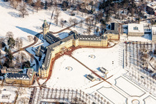 Wintry snowy Building complex in the park of the castle Schloss Karlsruhe in Karlsruhe in the state Baden-Wurttemberg, Germany from above