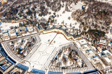 Wintry snowy Building complex in the park of the castle Schloss Karlsruhe in Karlsruhe in the state Baden-Wurttemberg, Germany seen from above