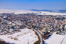 Aerial view of City view with railway line from the southeast in winter with snow in Kandel in the state Rhineland-Palatinate, Germany