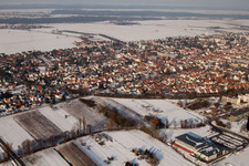 Aerial photograpy of City view with railway line from the southwest in winter with snow in Kandel in the state Rhineland-Palatinate, Germany