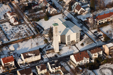 Aerial view of St. Pius Church in winter with snow in Kandel in the state Rhineland-Palatinate, Germany