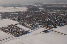 Brotäckerstraße in winter with snow in Steinweiler in the state Rhineland-Palatinate, Germany