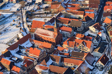 Protest. Church in the snow in Steinweiler in the state Rhineland-Palatinate, Germany from the plane