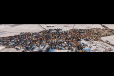 Panorama perspecitve of Wintry snowy Village - view on the edge of agricultural fields and farmland in Rohrbach in the state Rhineland-Palatinate, Germany