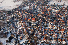 Oblique view of Wintry snowy Town View of the streets and houses of the residential areas in the district Ingenheim in Billigheim-Ingenheim in the state Rhineland-Palatinate