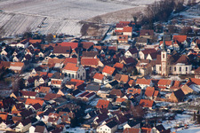 Oblique view of Winter snow-covered village view in Göcklingen in the state Rhineland-Palatinate, Germany