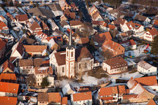 Winter snow-covered village view in Göcklingen in the state Rhineland-Palatinate, Germany from above