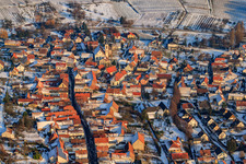 Main street in winter with snow in Göcklingen in the state Rhineland-Palatinate, Germany