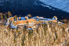 Madenburg castle ruins in winter with snow in Eschbach in the state Rhineland-Palatinate, Germany viewn from the air