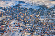 Wine-growing village from the north in winter with snow in Klingenmünster in the state Rhineland-Palatinate, Germany