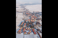 Wintry snowy Village - view on the edge of agricultural fields and farmland in Niederhorbach in the state Rhineland-Palatinate, Germany