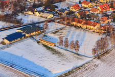 Aerial photograpy of Dierbachhalle and sports fields in winter when there is snow in Dierbach in the state Rhineland-Palatinate, Germany