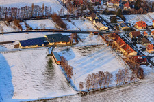 Dierbachhalle and sports fields in winter when there is snow in Dierbach in the state Rhineland-Palatinate, Germany from above