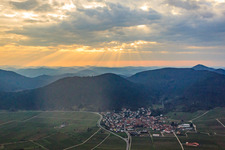 Wine-growing village at sunset above the Haardt in Eschbach in the state Rhineland-Palatinate, Germany