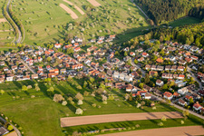 Aerial view of Village - view on the edge of agricultural fields and farmland in Schluttenbach in the state Baden-Wurttemberg, Germany