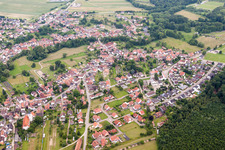 Aerial view of Village - view on the edge of agricultural fields and farmland in Scheibenhardt in the state Rhineland-Palatinate, Germany