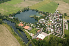 Camping with caravans and tents at the lake in the district Beinheim in Seltz in Grand Est, France