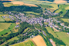 Village - view on the edge of agricultural fields and farmland in Mengerschied in the state Rhineland-Palatinate, Germany