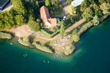 Aerial view of Camping with caravans and tents at a lake with beach in Gambsheim in Grand Est, France