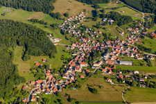 Village - view on the edge of agricultural fields and farmland in Climbach in Grand Est, France