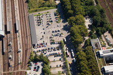 Track progress and building of the main station of the railway in Karlsruhe in the state Baden-Wurttemberg from the plane