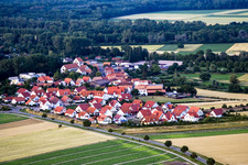 Oblique view of Village - view on the edge of agricultural fields and farmland in Kuhardt in the state Rhineland-Palatinate