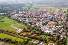Village - view on the edge of agricultural fields and farmland in Lambsheim in the state Rhineland-Palatinate, Germany
