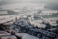 Church building Hinterstaedel church covered with snow in Jockgrim in the state Rhineland-Palatinate in winter