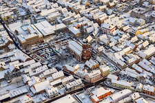 Aerial photograpy of Christmas market at Plätzl and around St. George's Church in snow in Kandel in the state Rhineland-Palatinate, Germany