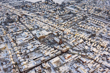 Oblique view of Christmas market at Plätzl and around St. George's Church in snow in Kandel in the state Rhineland-Palatinate, Germany