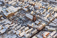 Christmas market at Plätzl and around St. George's Church in snow in Kandel in the state Rhineland-Palatinate, Germany from above