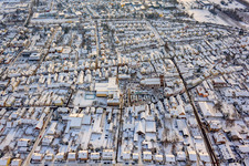 Christmas market at Plätzl and around St. George's Church in snow in Kandel in the state Rhineland-Palatinate, Germany seen from above