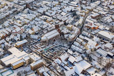 Christmas market at Plätzl and around St. George's Church in snow in Kandel in the state Rhineland-Palatinate, Germany from the plane