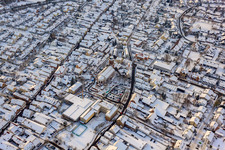 Bird's eye view of Christmas market at Plätzl and around St. George's Church in snow in Kandel in the state Rhineland-Palatinate, Germany