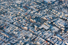Aerial view of Christmas market at Plätzl and around St. George's Church in snow in Kandel in the state Rhineland-Palatinate, Germany