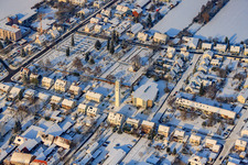 Catholic Church of St. Pius, cemetery in winter with snow in Kandel in the state Rhineland-Palatinate, Germany