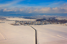 View of the town in winter with snow from the east in Steinweiler in the state Rhineland-Palatinate, Germany