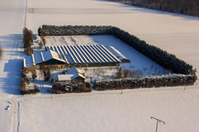 Aerial view of Sudetenhof in winter with snow in Steinweiler in the state Rhineland-Palatinate, Germany