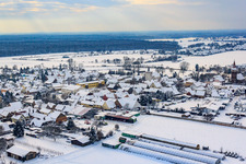 Village view in winter with snow in Minfeld in the state Rhineland-Palatinate, Germany