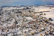 Village view from the east in winter with snow in Minfeld in the state Rhineland-Palatinate, Germany