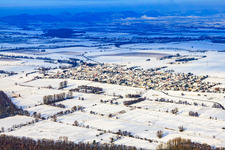 Village view from the southeast in snow in winter in Minfeld in the state Rhineland-Palatinate, Germany