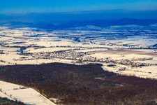 Village view from the southeast in snow in winter in Freckenfeld in the state Rhineland-Palatinate, Germany