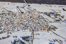 Village view from the south in snow in winter in the district Büchelberg in Wörth am Rhein in the state Rhineland-Palatinate, Germany