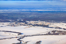 Overview of the two villages separated by the Lauter river Scheibenhard (France) and Scheibenhardt (Germany) from the southeast in winter with snow in Scheibenhard in the state Bas-Rhin, France