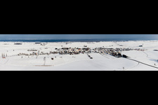 Wintry snowy Panoramic perspective Village - view on the edge of agricultural fields and farmland in Oberlauterbach in Grand Est, France