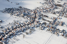 Wintry snowy Church building in the village of in Schleithal in Grand Est, France