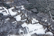 Wintry snowy Curved loop of the riparian zones on the course of the river of Lauter in Wissembourg in Grand Est, France