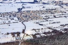 Village view from the south in snow in winter in Steinfeld in the state Rhineland-Palatinate, Germany