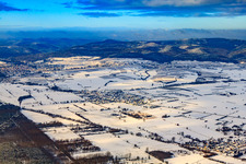 Village view from the southeast in snow in winter in Schweighofen in the state Rhineland-Palatinate, Germany